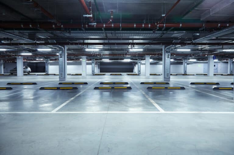 Horizontal image of empty underground parking lot