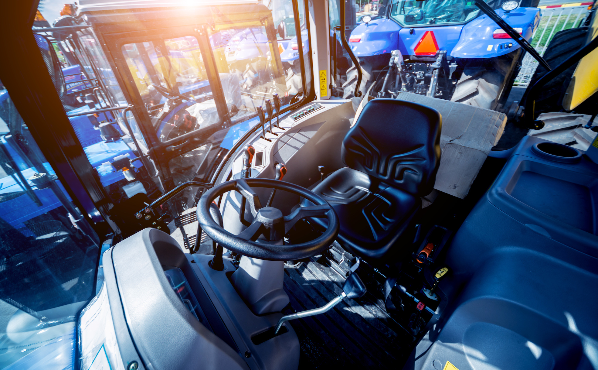 Modern tractor cabin interior. Agricultural exhibition