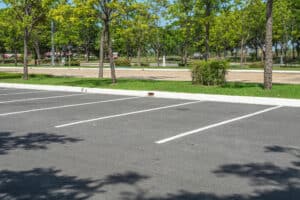 Empty parking lot with trees